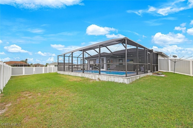 view of yard featuring a fenced in pool and a lanai