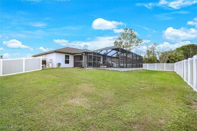 view of yard featuring glass enclosure