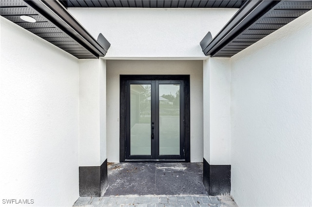 property entrance featuring french doors