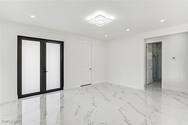 spare room featuring french doors