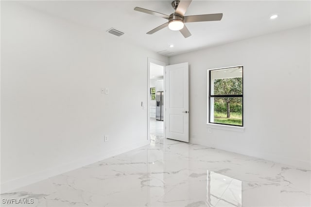 empty room featuring ceiling fan