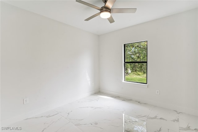 spare room with ceiling fan