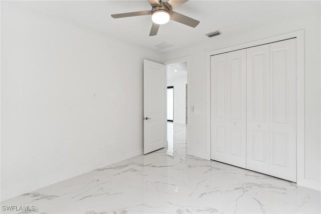 unfurnished bedroom with a closet and ceiling fan