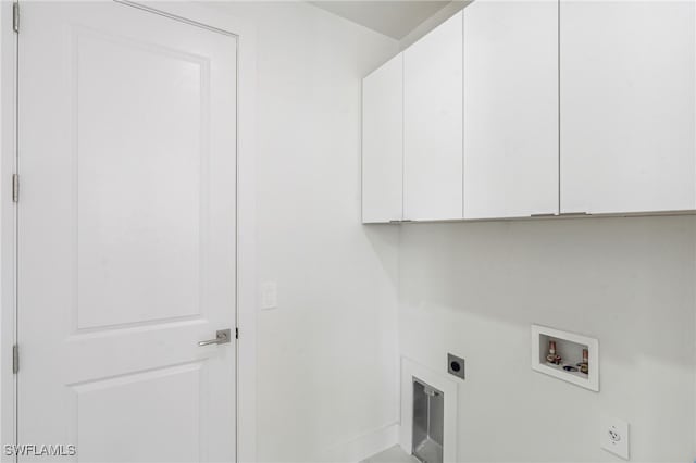 laundry room featuring hookup for an electric dryer, hookup for a washing machine, and cabinets