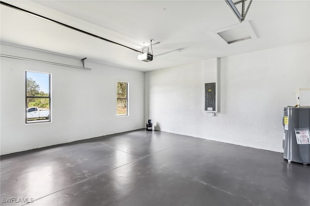 garage featuring a garage door opener, water heater, and electric panel