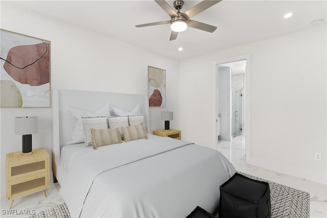 bedroom featuring ensuite bathroom and ceiling fan