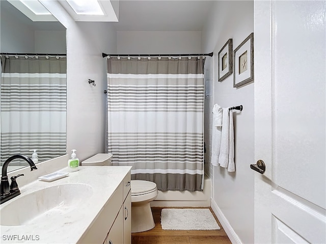 full bathroom with vanity, shower / tub combo with curtain, toilet, and wood-type flooring