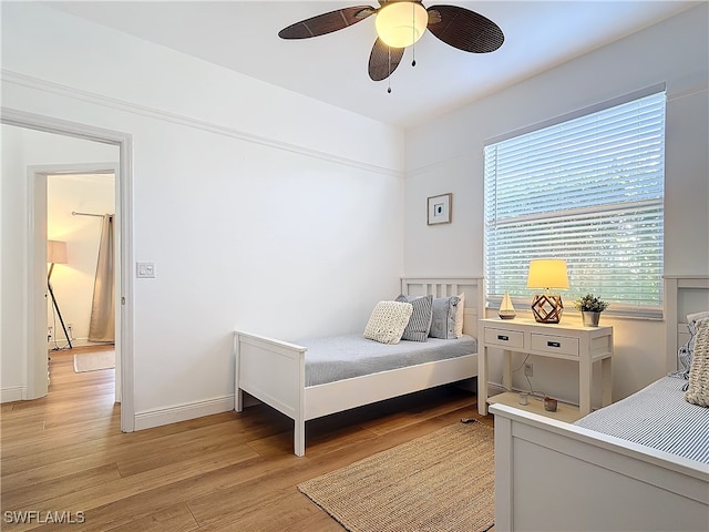 bedroom featuring light hardwood / wood-style flooring and ceiling fan