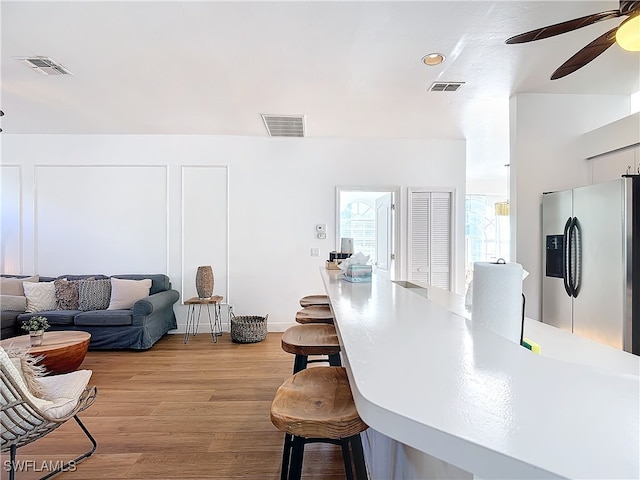 interior space featuring light hardwood / wood-style floors and ceiling fan