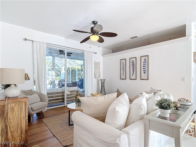 living room with ceiling fan and wood-type flooring