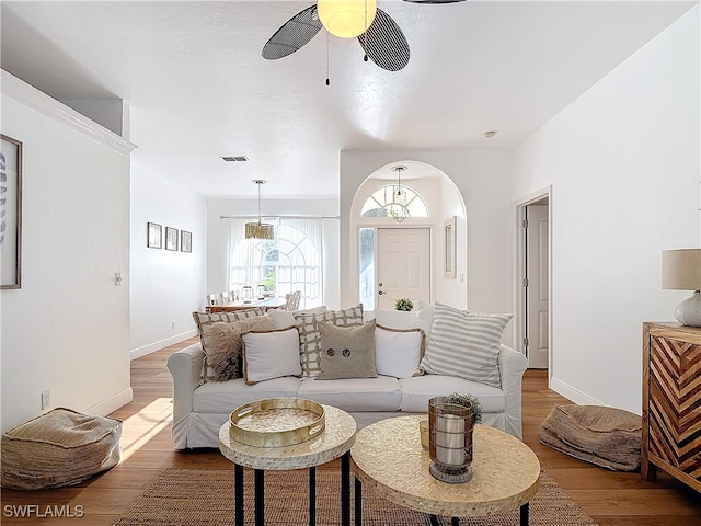 living room with ceiling fan and hardwood / wood-style floors