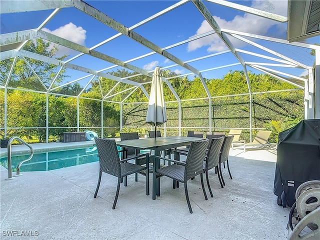 view of patio / terrace with area for grilling and a lanai