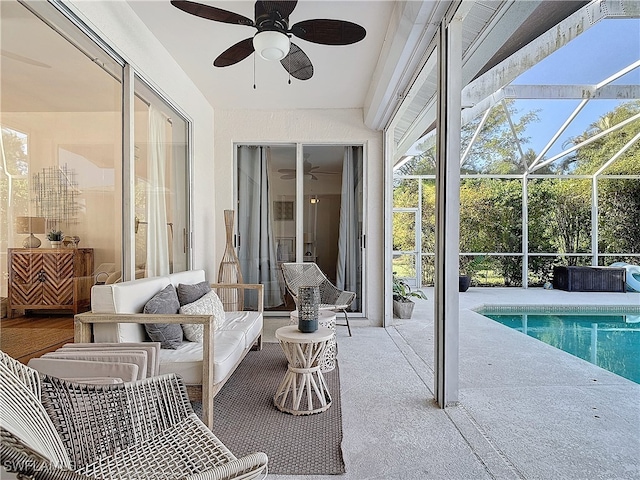 sunroom / solarium with a pool and ceiling fan