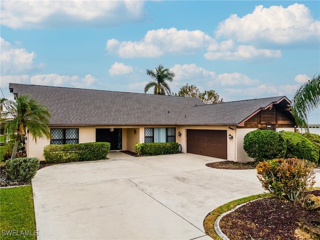 ranch-style home featuring a garage