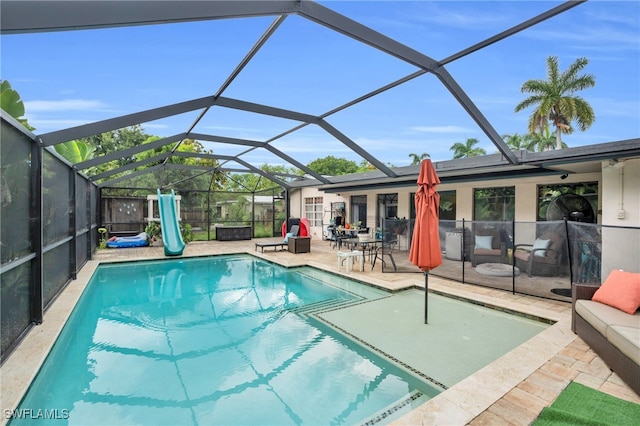 view of pool featuring a patio area and a lanai