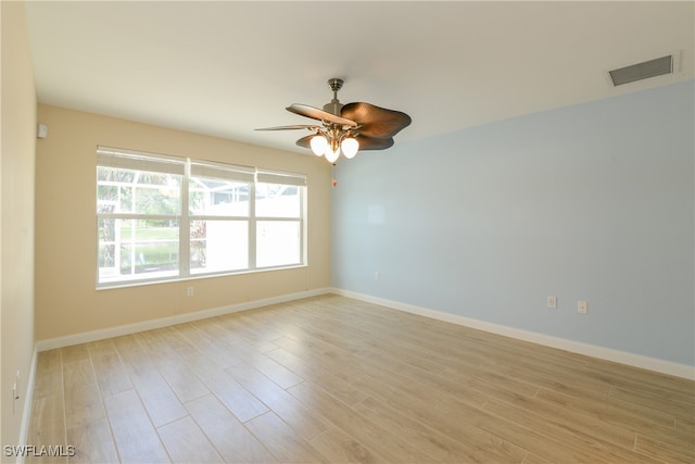 unfurnished room featuring ceiling fan and light hardwood / wood-style flooring