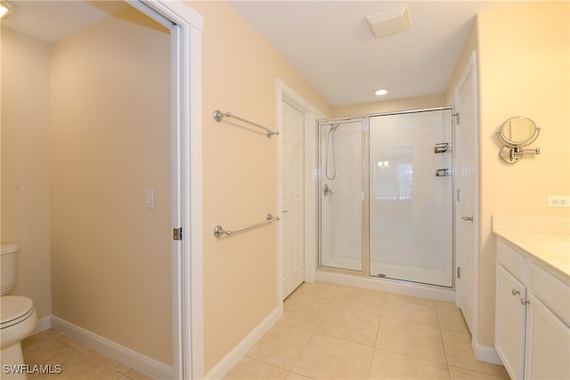 bathroom featuring walk in shower, tile patterned flooring, vanity, and toilet