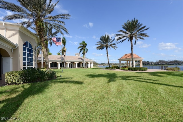 view of yard featuring a water view and a gazebo