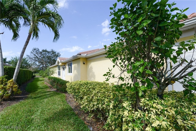 view of home's exterior featuring a lawn