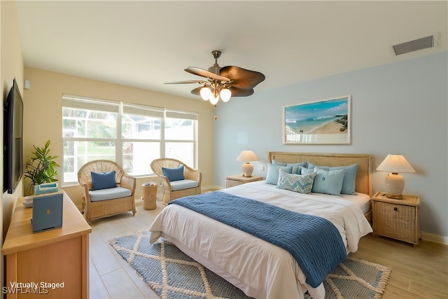 bedroom featuring light hardwood / wood-style floors and ceiling fan