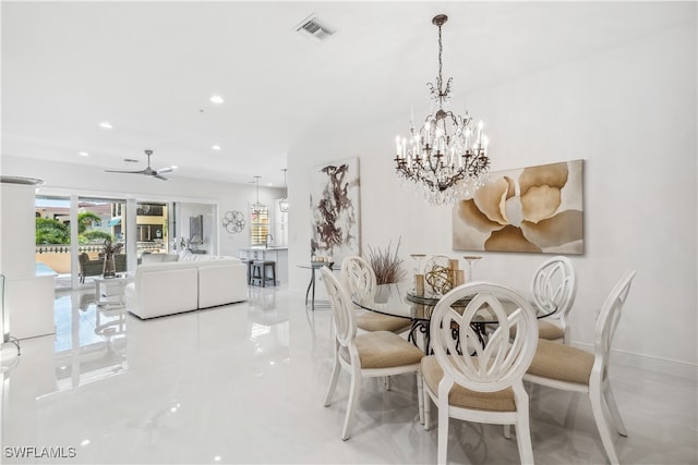 dining room featuring ceiling fan with notable chandelier