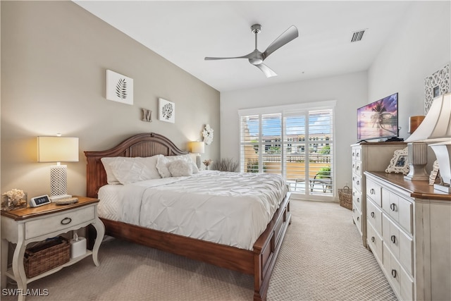 bedroom featuring access to outside, ceiling fan, and light colored carpet