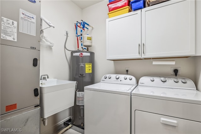 washroom featuring sink, cabinets, separate washer and dryer, electric water heater, and heating unit