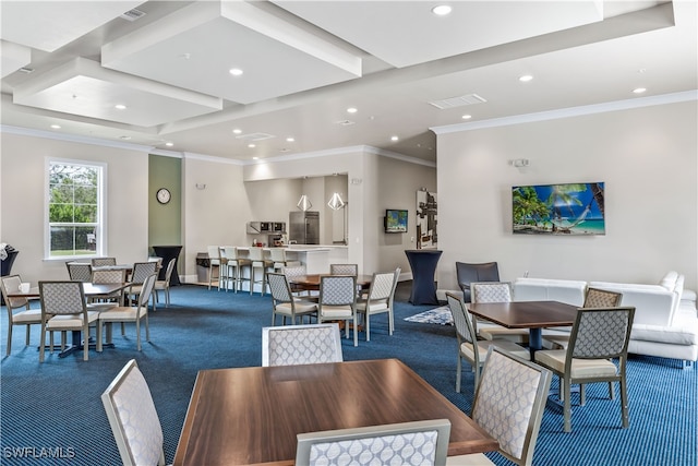 dining area with carpet floors and crown molding