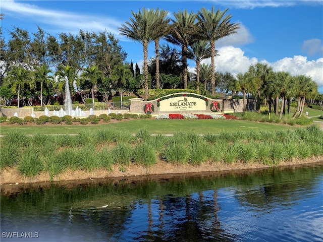 community sign featuring a water view