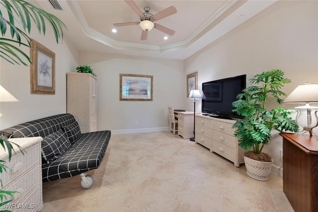 sitting room featuring ornamental molding, ceiling fan, and a raised ceiling