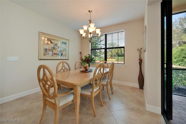 8757 Bellano Ct Unit 6-104, Naples, FL 34119 - dining room featuring an inviting chandelier, baseboards, and light tile patterned flooring