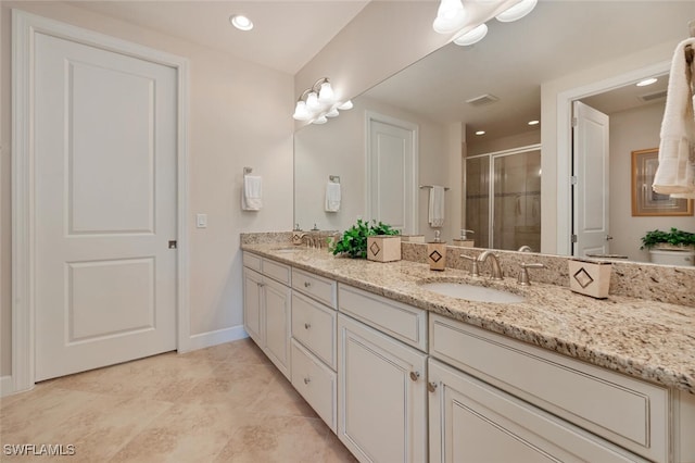 bathroom with a shower with door, vanity, and toilet