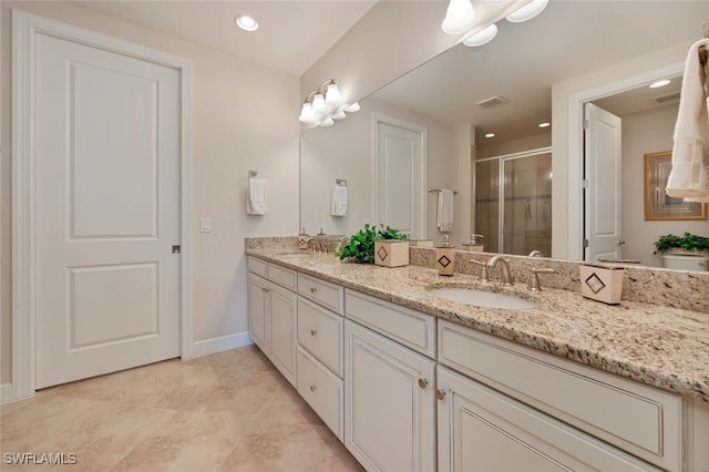 8757 Bellano Ct Unit 6-104, Naples, FL 34119 - full bathroom with a sink, a stall shower, double vanity, and visible vents