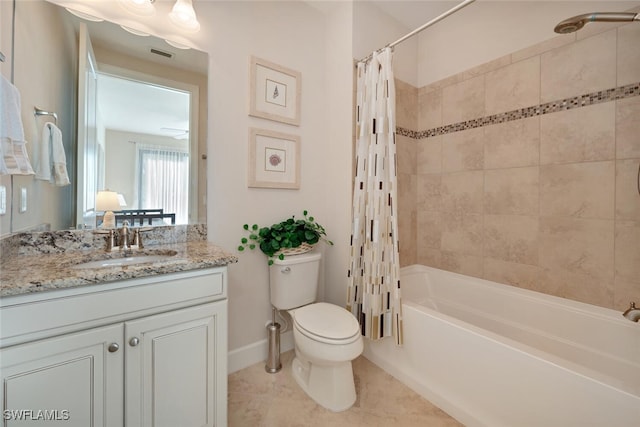 full bathroom featuring vanity, shower / tub combo with curtain, toilet, and tile patterned floors