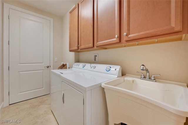 8757 Bellano Ct Unit 6-104, Naples, FL 34119 - clothes washing area with a sink, cabinet space, and washer and dryer