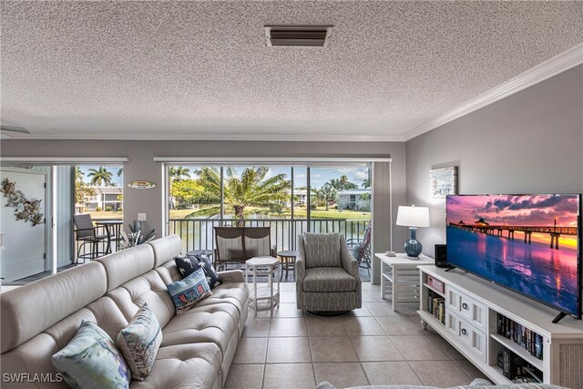 tiled living room featuring crown molding and a textured ceiling