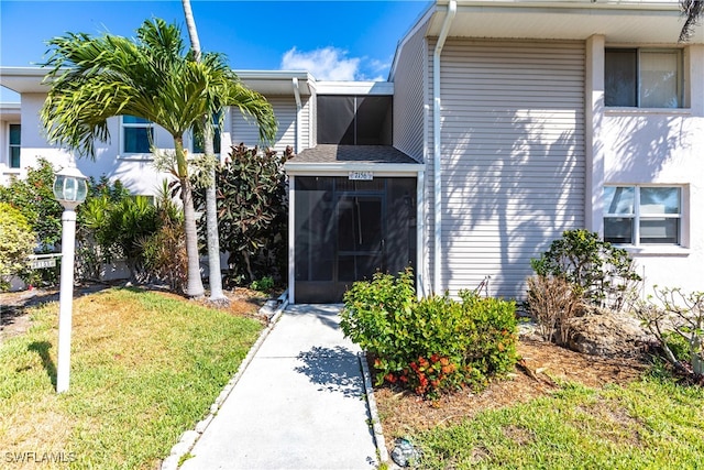 property entrance with a yard