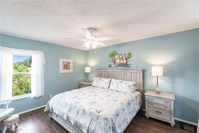 bedroom featuring a textured ceiling, ceiling fan, and dark hardwood / wood-style flooring