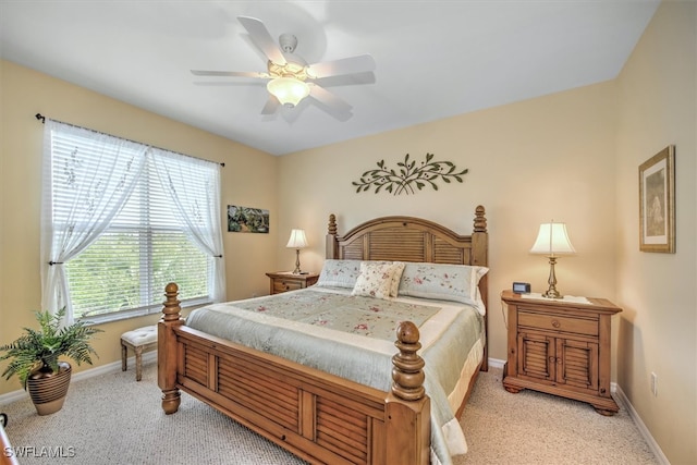 bedroom with light colored carpet and ceiling fan