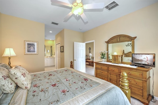 tiled bedroom featuring connected bathroom and ceiling fan