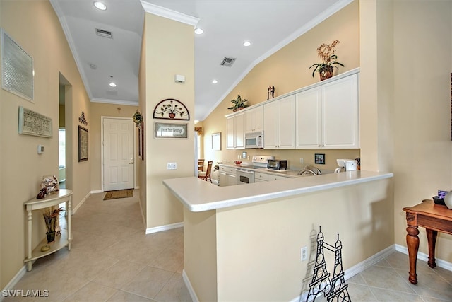 kitchen featuring white appliances, kitchen peninsula, white cabinetry, ornamental molding, and light tile patterned floors