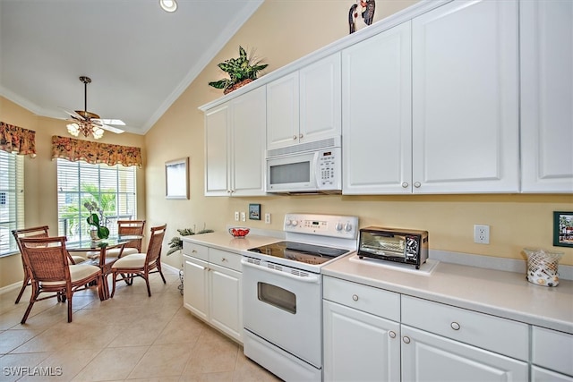 kitchen featuring lofted ceiling, crown molding, white cabinetry, and white appliances