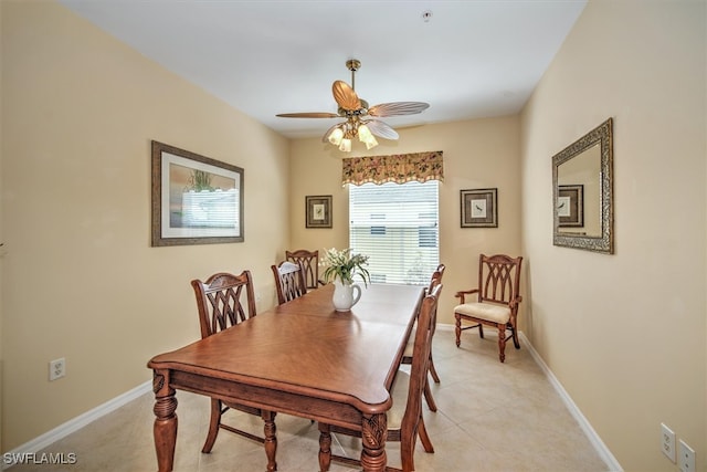 tiled dining area featuring ceiling fan