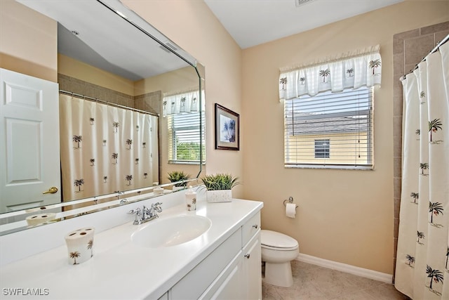 bathroom featuring toilet, a shower with curtain, vanity, and tile patterned floors