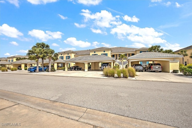 view of front of home with a carport