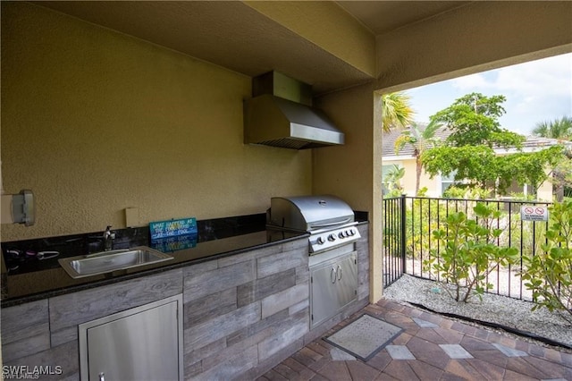 view of patio / terrace featuring area for grilling and sink