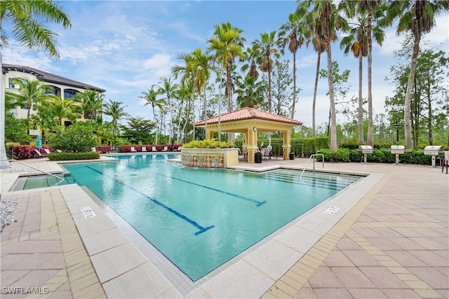 pool with a gazebo, area for grilling, and a patio