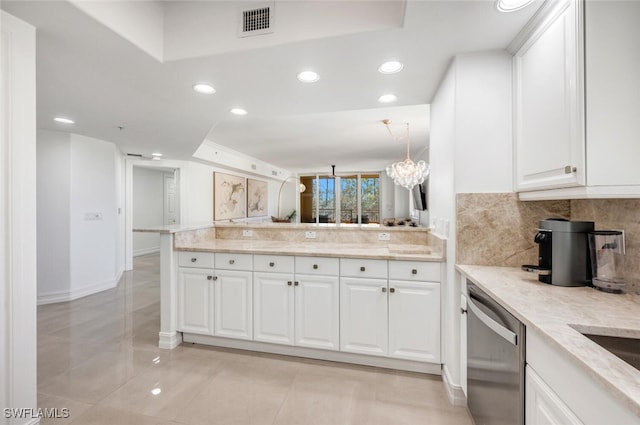 kitchen with visible vents, tasteful backsplash, stainless steel dishwasher, white cabinetry, and a peninsula