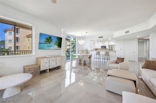 living room with a notable chandelier, marble finish floor, crown molding, and visible vents