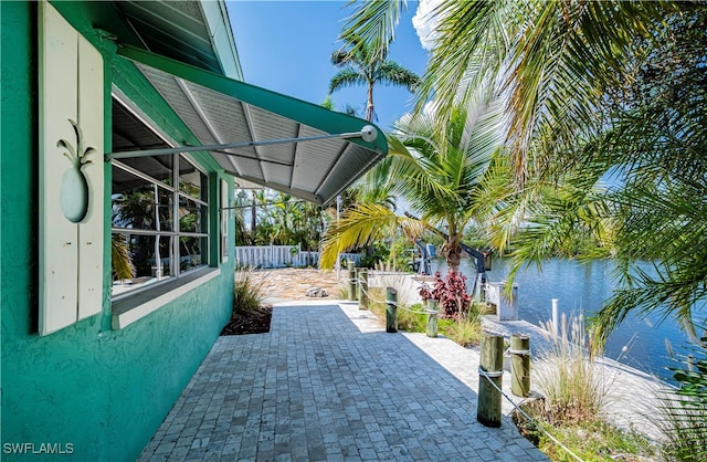 view of patio with a water view